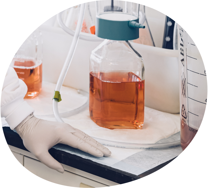 Jar of liquid on counter in lab